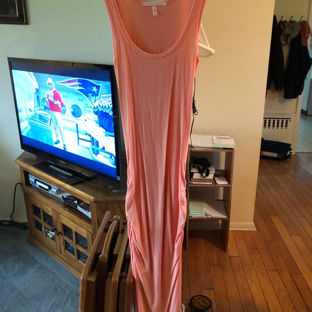 Coral colored form fitting maxi dress